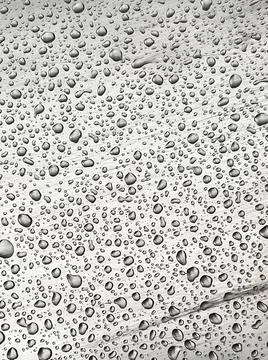 Abstract background with small raindrops on imperfect metal. Raindrops on Stock Photos