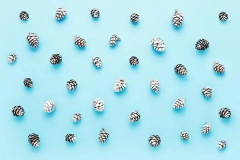 Abstract background. Small silver cones on a blue background. Top view Stock Photos