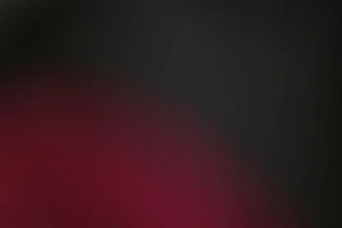 Abstract background with a smooth transition from deep red to black color Stock Photos