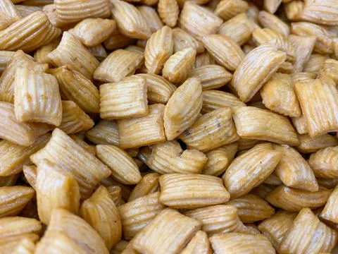 Abstract background of snacks (pastry) in the shape of flat squares. Stock Photos