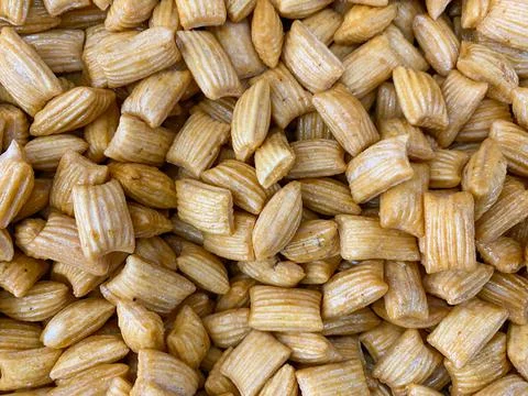 Abstract background of snacks (pastry) in the shape of flat squares. Stock Photos