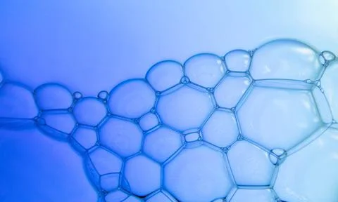 Abstract background of soap bubbles on blue water Stock Photos