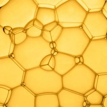 Abstract background of soap bubbles on yellow background Stock Photos