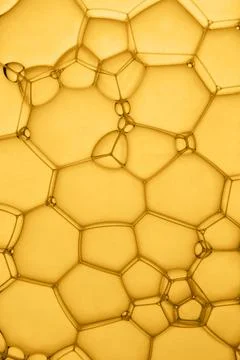 Abstract background of soap bubbles on yellow background Stock Photos