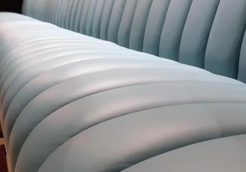 Abstract background. Soft convex wall panels, in white leather. Futuristic white Stock Photos