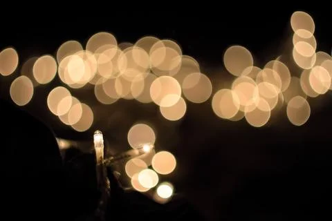 Abstract background with soft glowing gold bokeh lights and festive illumin.. 스톡 사진