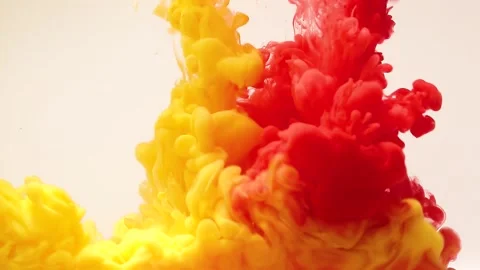 Abstract background of splashes of yellow and red paint in water. Stock Footage 143561793