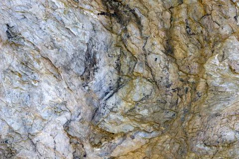 Abstract background. Stone formation of a sheer cliff close-up. Stock Photos