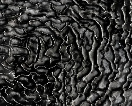 Abstract background from a structural surface of gray-black color Stock Photos