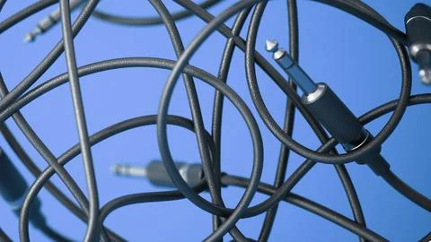 Abstract background with tangled audio cables with jacks. 3D illustration Illustrazione stock