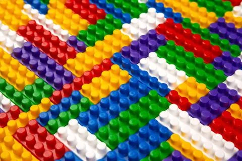 Abstract background texture of colored constructor blocks. Background of co.. Stock Photos