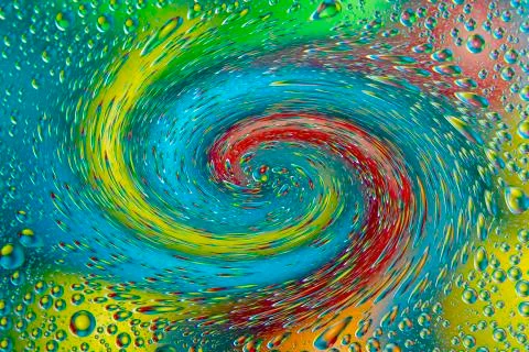 Abstract background texture in the form of blurred twisted color round spots Stock Illustration