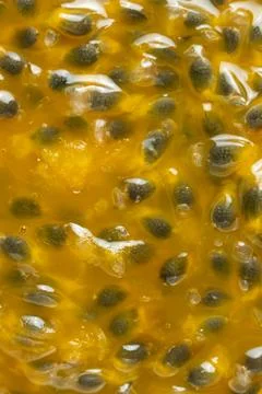 Abstract background texture of ripe passion fruit pulp with seeds Stock Photos