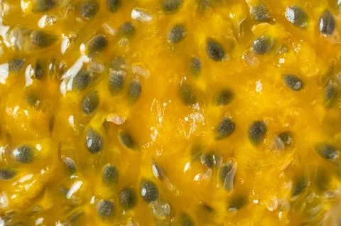 Abstract background texture of ripe passion fruit pulp with seeds Stock Photos
