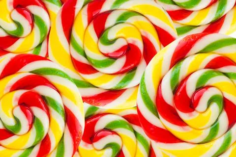 Abstract background texture of round lollipops. Rainbow colorful background o Stock Photos