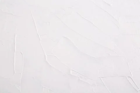 Abstract background texture of strokes of white art paint on canvas. Stock Photos