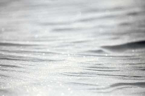 Abstract background texture of the surface of the white snow in winter Stock Photos