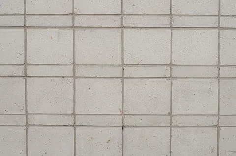 Abstract background of tile cladding of the facade of the building. Grey Stock Photos