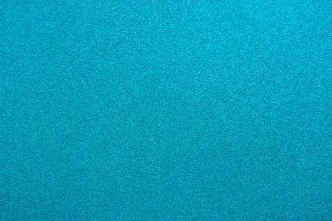 Abstract background in turquoise color. An empty, flat surface with a fine Stock Photos