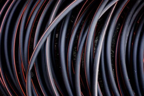 Abstract background of twisted cable red and black color lines Stock Photos
