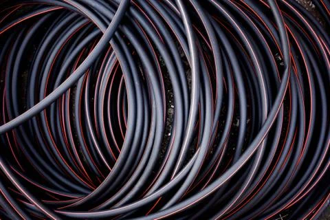 Abstract background of twisted cable red and black color lines Stock Photos