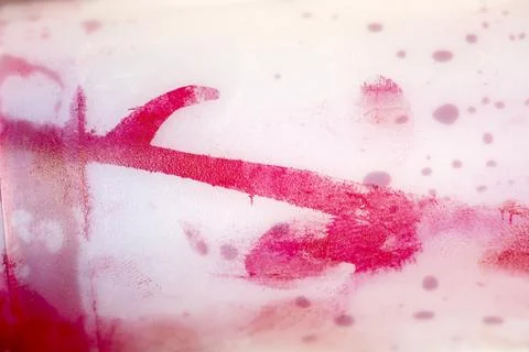 Abstract background of vibrant red liquid ink and droplets spreading on a l.. 스톡 사진