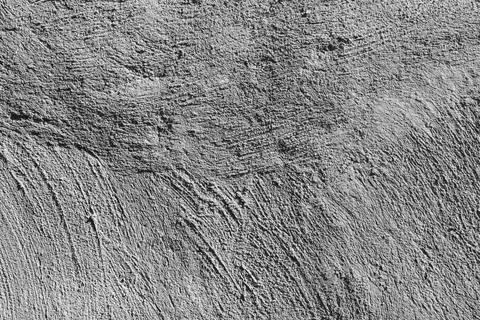 Abstract background from a wall with old gray plaster. Stock Photos