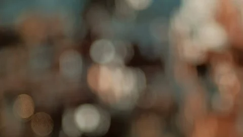 Abstract background. Warm glittery bokeh moving in horizontal direction. Stock Footage 123493960