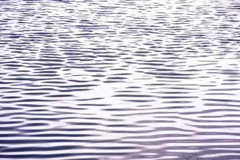 Abstract background of wave on the surface, river surface with sun light refl Stock Photos