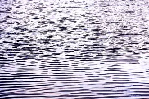 Abstract background of wave on the surface, river surface with sun light refl Stock Photos