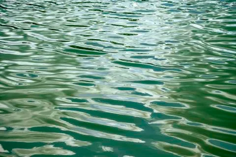 Abstract background of wave on the surface, river surface with sun light refl Stock Photos