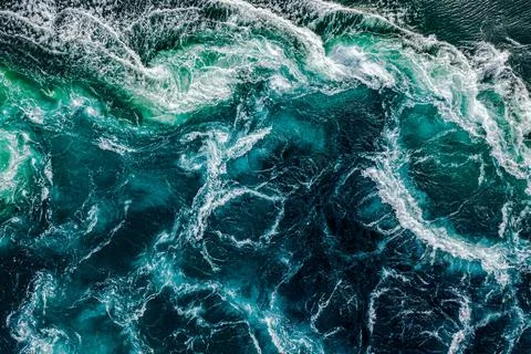Abstract background. Waves of water of the river and the sea meet each othe.. Stock Photos
