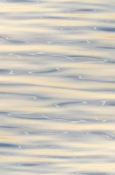 Abstract background waves on water surface on clear weather morning Stock Photos