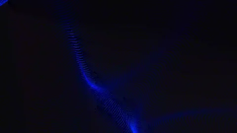 Abstract background with wavy surface made of blue dots on black. Grunge ha.. Stock Footage 247902762