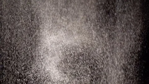 Abstract background. Wheat flour spots on black. Stock-Footage 85279222