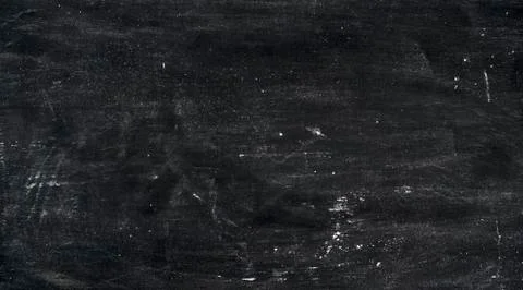 Abstract background. Wheat flour spots on old black baking sheet. Top view Stock Photos