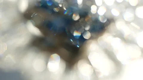 Abstract background - white and blue sparks glisten in the sun. Video stock 150621323
