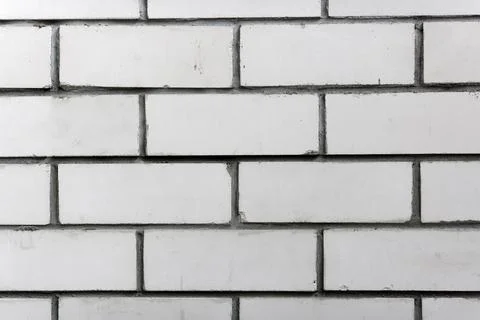 Abstract background. White brick wall close-up. Stock Photos