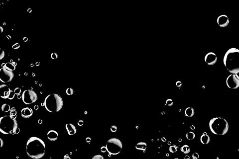 Abstract background with white bubbles on a black background. Perfect for d.. Stock Photos