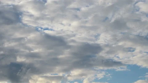 Abstract background of white fluffy clouds on a bright blue sky Stock Footage 138957648