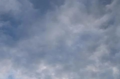 Abstract background of white fluffy clouds on a bright blue sky Fotos de archivo