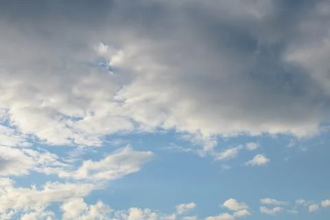 Abstract background of white fluffy clouds on a bright blue sky Stock Photos