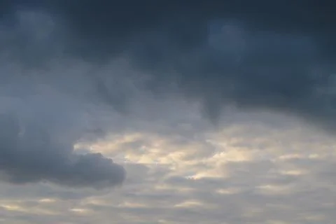 Abstract background of white fluffy clouds on a bright blue sky Stock Photos
