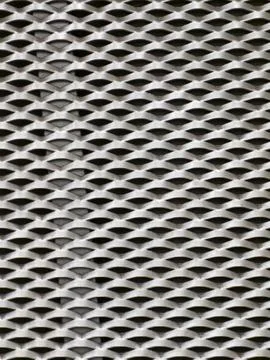 Abstract background of a white industrial expanded metal mesh pattern Stock Photos