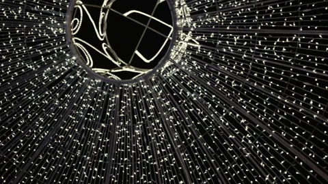 Abstract background: white lights on the black sky. The dome of the Christmas li Stock Footage 99007832
