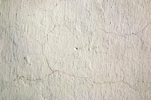 Abstract background. White lime wall with fine cracks. Stock Photos
