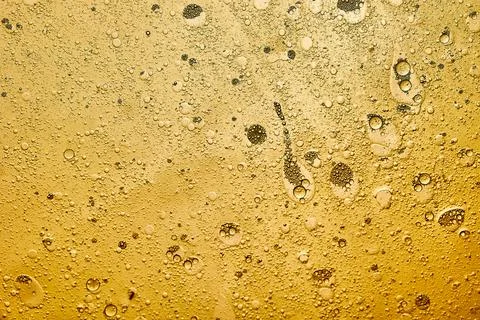 Abstract background of yellow bubbles generated in water and oil Stock Photos