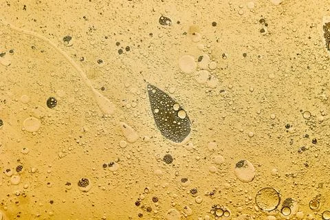 Abstract background of yellow bubbles generated in water and oil Stock Photos