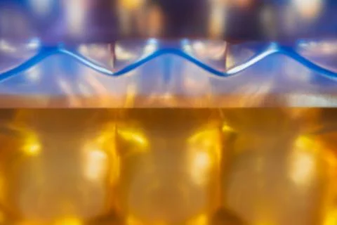 Abstract background with a zigzag line of violet color on a blurred backgroun Stock Photos