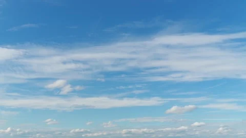 Abstract beautiful background of wispy white clouds in blue sky timelapse video Stock Footage 342400331